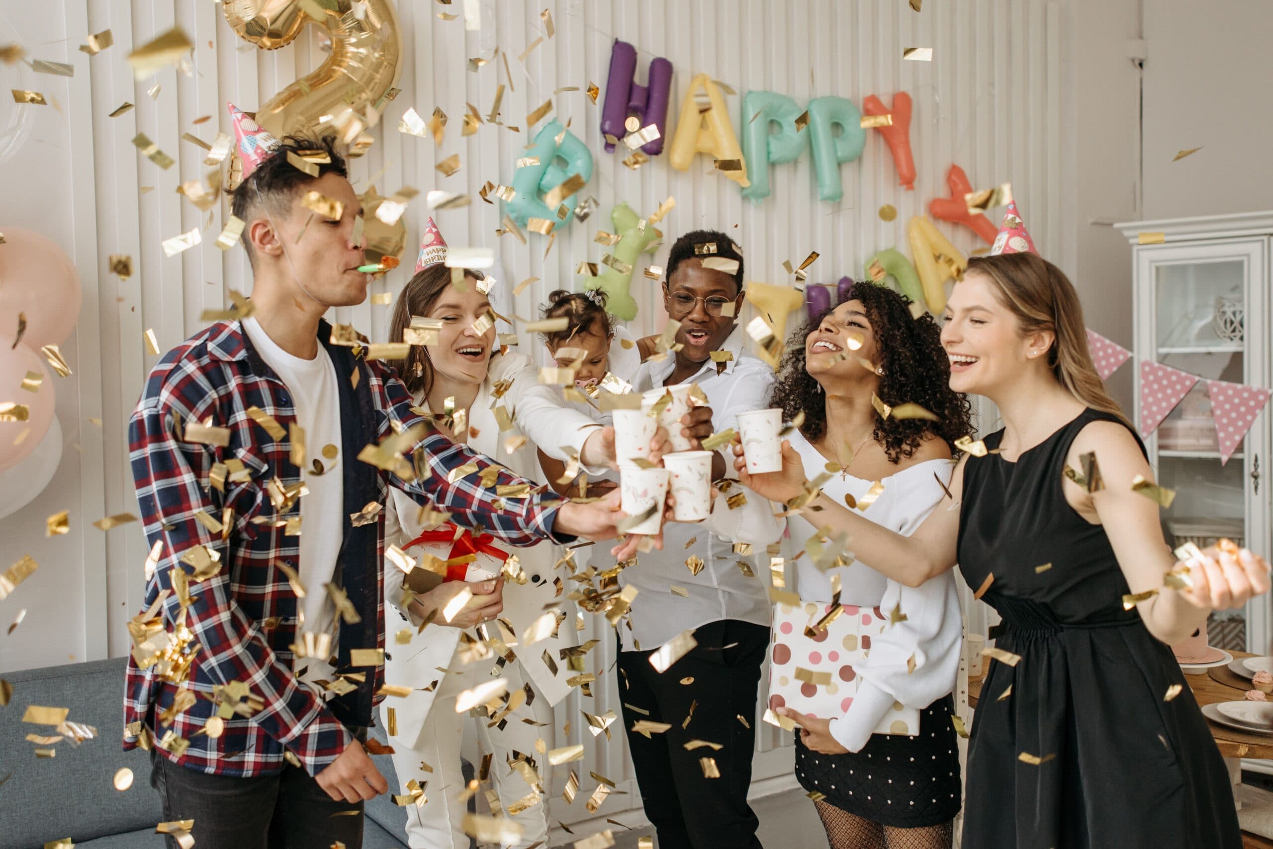 Friends celebrating at a birthday party with quiz game